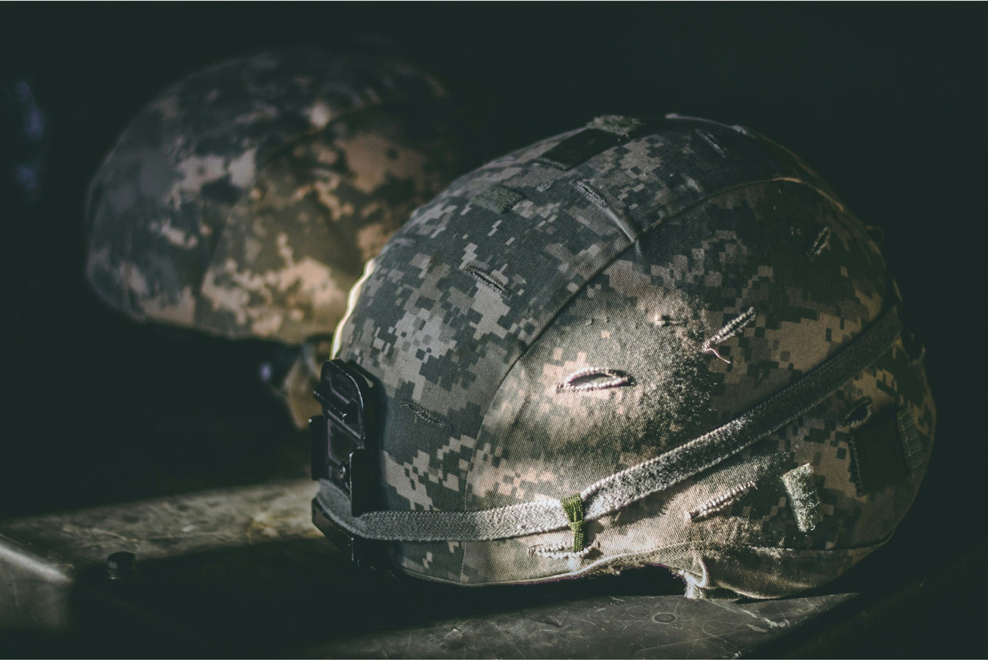 two camoflauge helmets